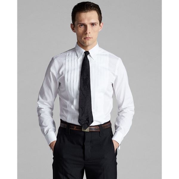 Slim-fitting shirt made with soft cotton poplin. Constructed with a pleated bib and French cuffs. Finished with genuine mother-of-pearl buttons.