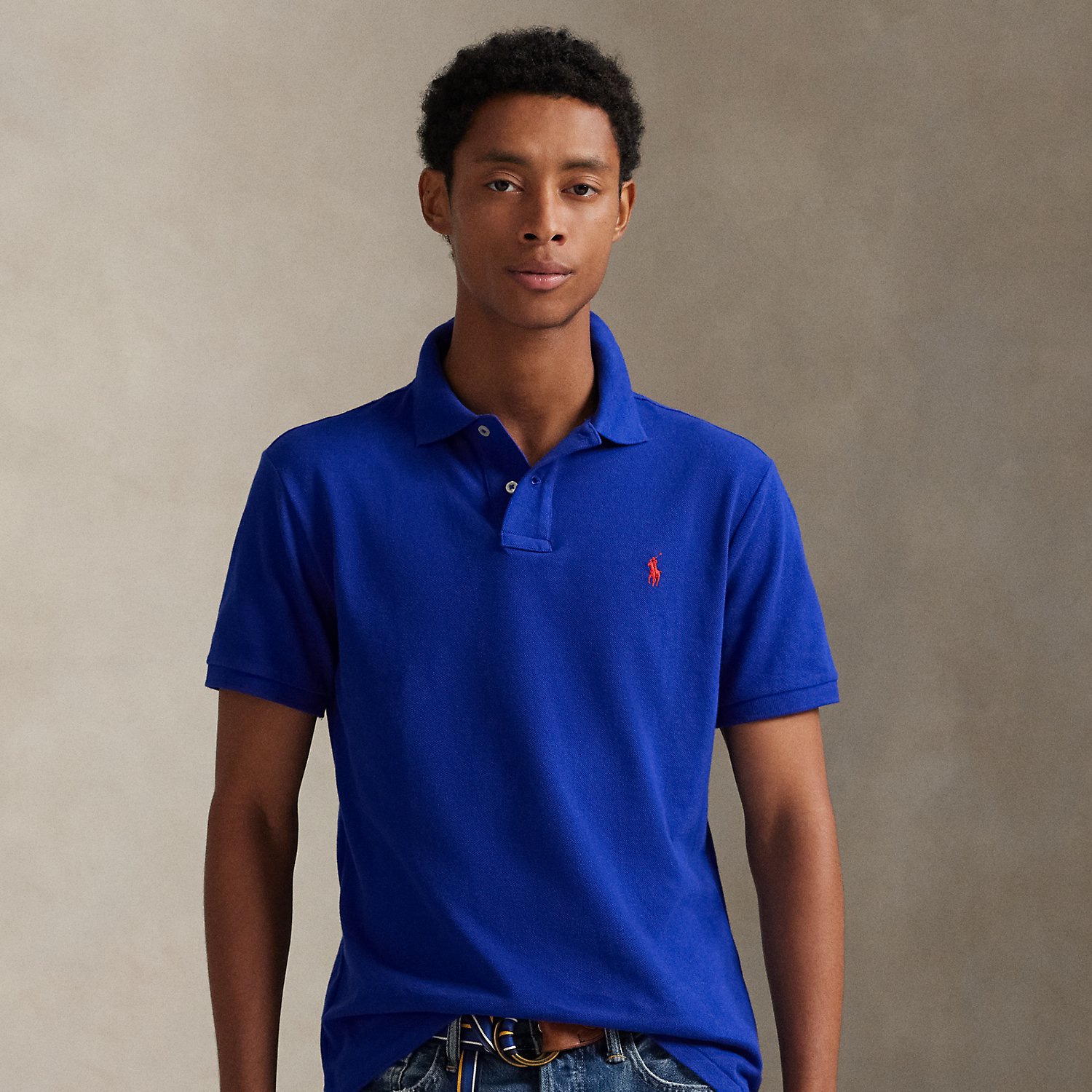 An American style standard since 1972, the Polo shirt has been imitated but never matched. Over the decades, Ralph Lauren Lauren has re-imagined his signature style in a wide array of colours and fits, yet all retain the quality and attention to detail of the iconic original. This trim version is made from our highly breathable cotton mesh, which offers a textured look and a soft feel.