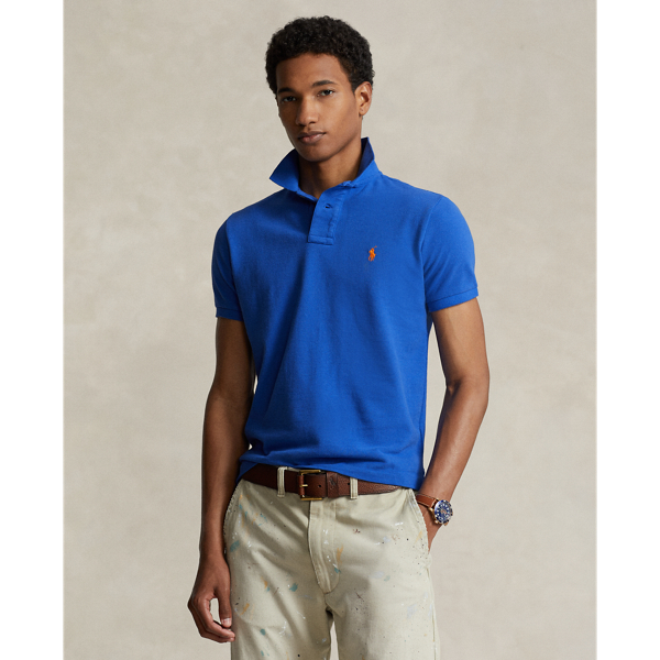 An American style standard since 1972, the Polo shirt has been imitated but never matched. Over the decades,  Ralph Lauren Lauren has re-imagined his signature style in a wide array of colours and fits, yet all retain the quality and attention to detail of the iconic original. This trim version is made from our highly breathable cotton mesh, which offers a textured look and a soft feel.