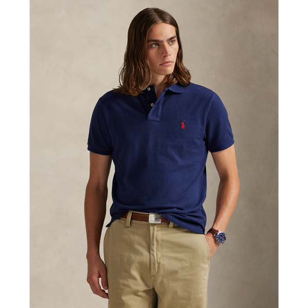 An American style standard since 1972, the Polo shirt has been imitated but never matched. Over the decades, Ralph Lauren Lauren has re-imagined his signature style in a wide array of colours and fits, yet all retain the quality and attention to detail of the iconic original. This trim version is made from our highly breathable cotton mesh, which offers a textured look and a soft feel.
