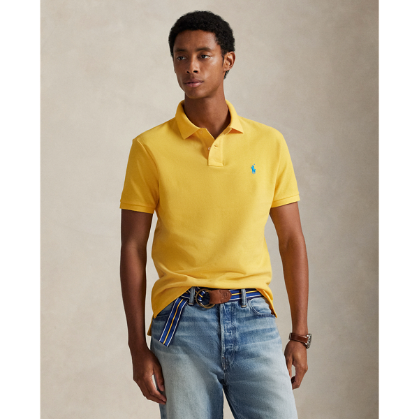 An American style standard since 1972, the Polo shirt has been imitated but never matched. Over the decades,  Ralph Lauren Lauren has re-imagined his signature style in a wide array of colours and fits, yet all retain the quality and attention to detail of the iconic original. This trim version is made from our highly breathable cotton mesh, which offers a textured look and a soft feel.