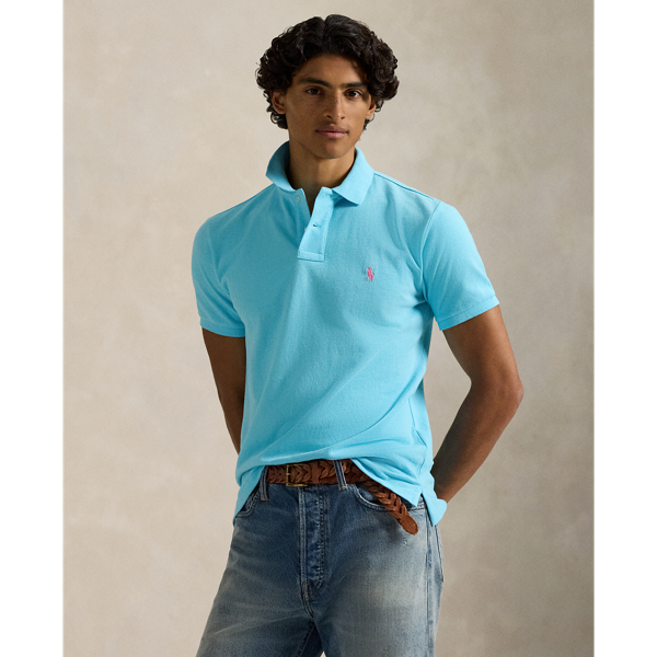An American style standard since 1972, the Polo shirt has been imitated but never matched. Over the decades, Ralph Lauren Lauren has re-imagined his signature style in a wide array of colours and fits, yet all retain the quality and attention to detail of the iconic original. This trim version is made from our highly breathable cotton mesh, which offers a textured look and a soft feel.