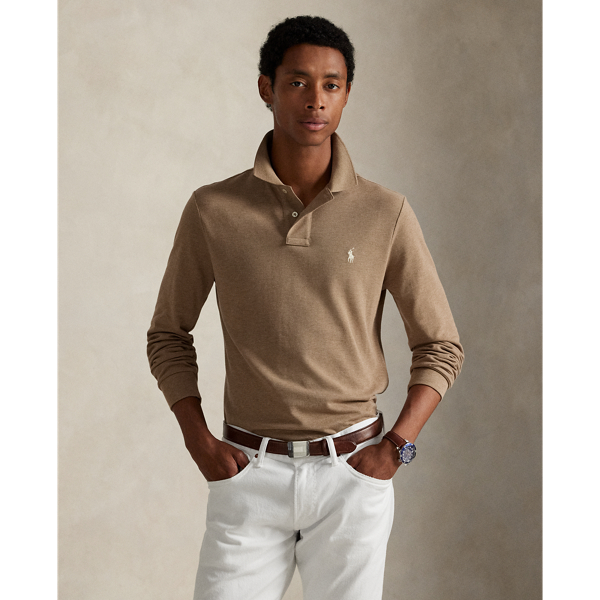 An American style standard since 1972, the Polo shirt has been imitated but never matched. Over the decades, Ralph Lauren Lauren has re-imagined his signature style in a wide array of colours and fits, yet all retain the quality and attention to detail of the iconic original. This trim version is made from our highly breathable cotton mesh, which offers a textured look and a soft feel.