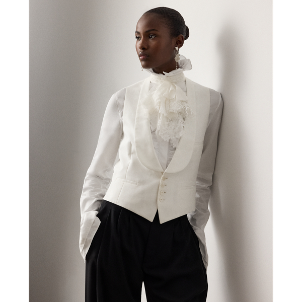 Continuing  Ralph Lauren Lauren's tradition of reinterpreting traditional menswear codes into feminine style, the Zeke waistcoat recasts a men's Purple Label silhouette with a slightly longer length and a shawl collar. Tailored with front waist darts and welt pockets, this cotton piqué waistcoat is designed with a single-breasted four-button placket embellished with genuine mother-of-pearl buttons.