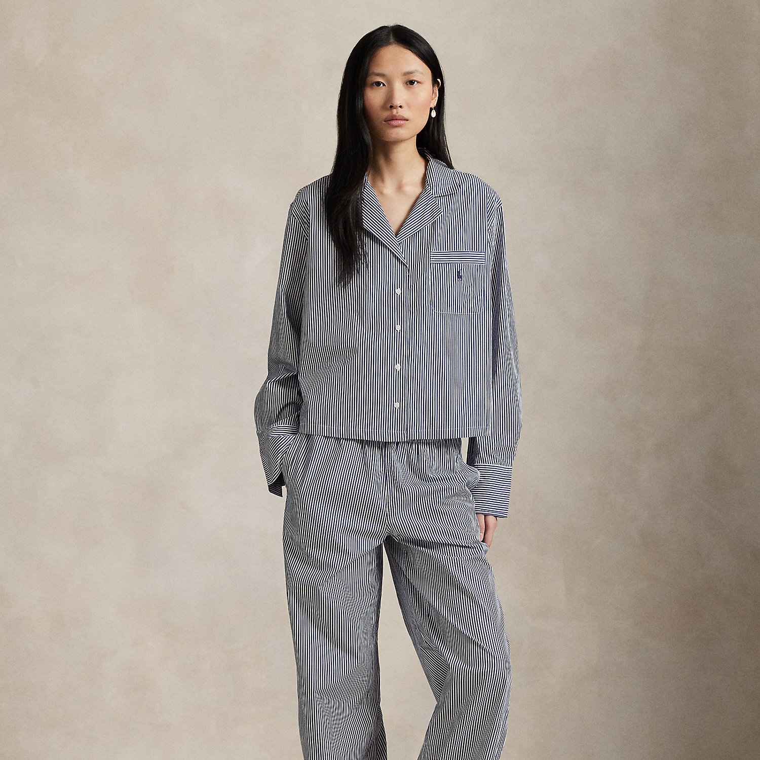This two-piece pyjama set is designed with classic shirting stripes and embroidered with our signature Pony. Crafted for comfort and longevity, it's made with cotton poplin specially selected for its breathability and soft hand feel that will only get better over time. Ralph Lauren Lauren partners with Better Cotton™ to improve cotton farming globally. Better Cotton trains farmers to use water efficiently, care for the health of soil and natural habitats, reduce use of the most harmful chemicals and implement the principles of decent work.