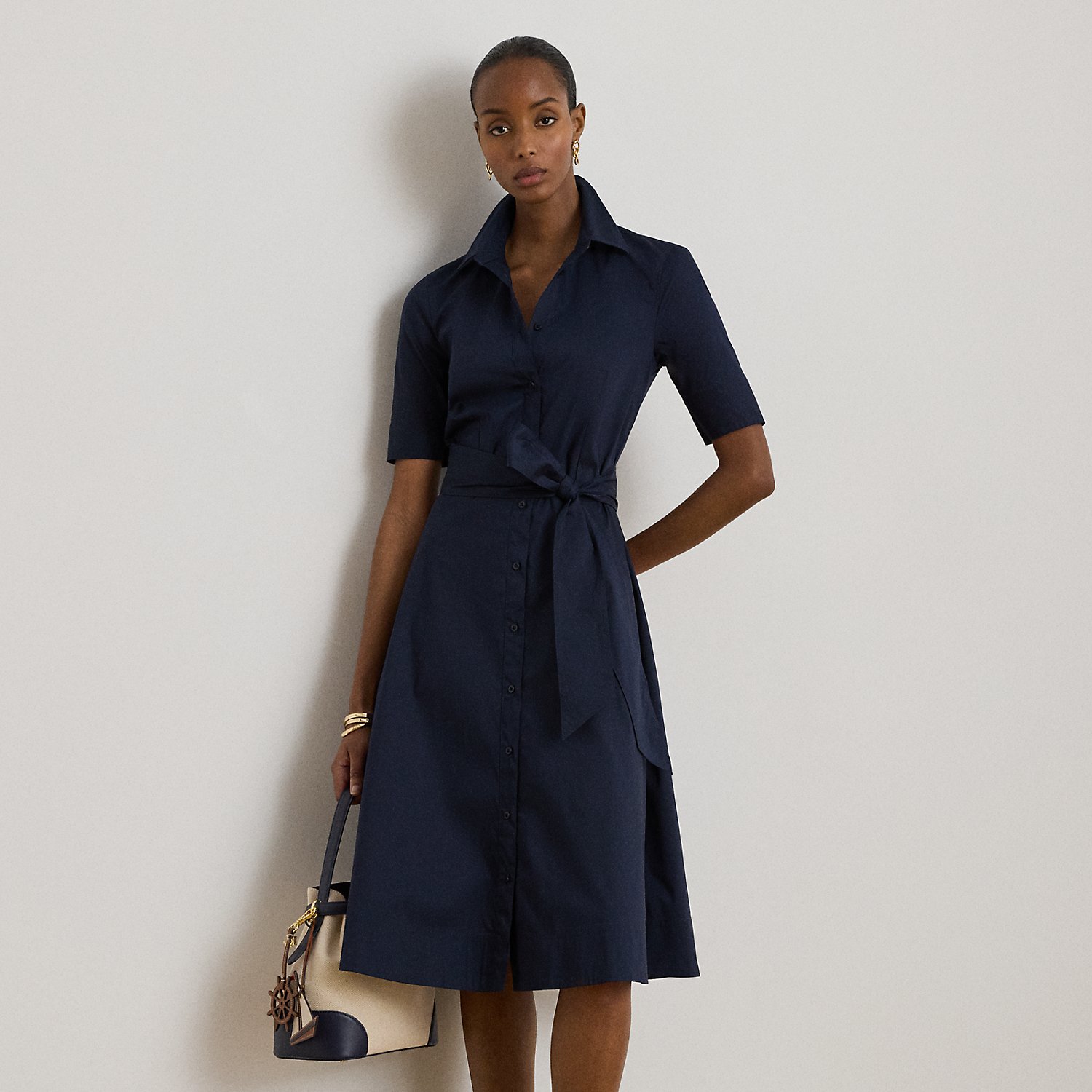 This iteration of Lauren's iconic shirtdress is defined by a fit-and-flare silhouette, signature engraved buttons and a waist-accentuating self-belt. Equal parts stylish and comfortable, it's made with a lightweight stretch-cotton blend.