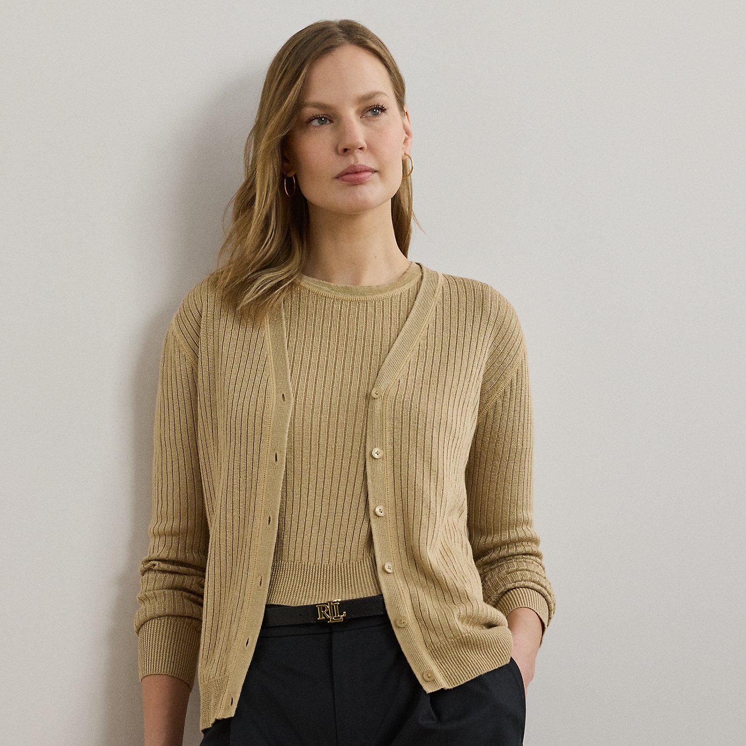Crafted from a lightweight linen blend, this essential V-neck cardigan is rib-knit for rich dimension. "Lauren Ralph Lauren Lauren"-engraved imitation pearl buttons add a signature finish.