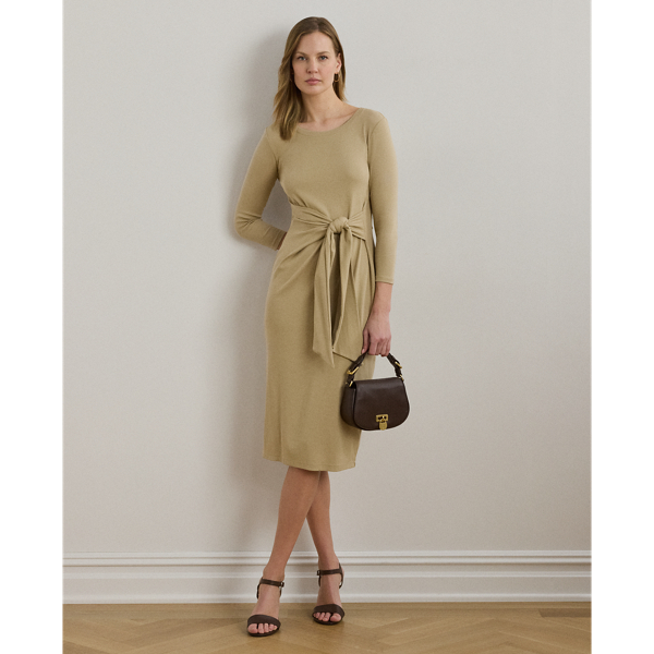 Rib-knit with a soft stretch-cotton blend, this long-sleeve crewneck dress is cut for a slim-fitting silhouette and a calf-grazing midi length. A tie-front design at the waist adds contemporary flare, while a skirt slit affords ease of movement.