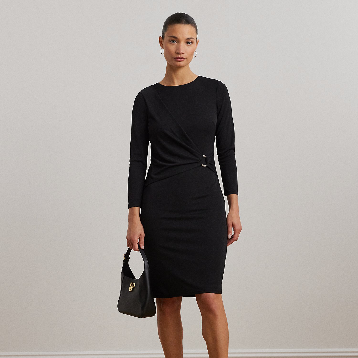 Detailed with an "LRL Lauren Ralph Lauren Lauren"-engraved metal O-ring on the waist for iconic style, this essential three-quarter-sleeve dress is cut for a figure-skimming sheath silhouette. Its smooth stretch jersey fabrication offers ease of movement and a soft hand.