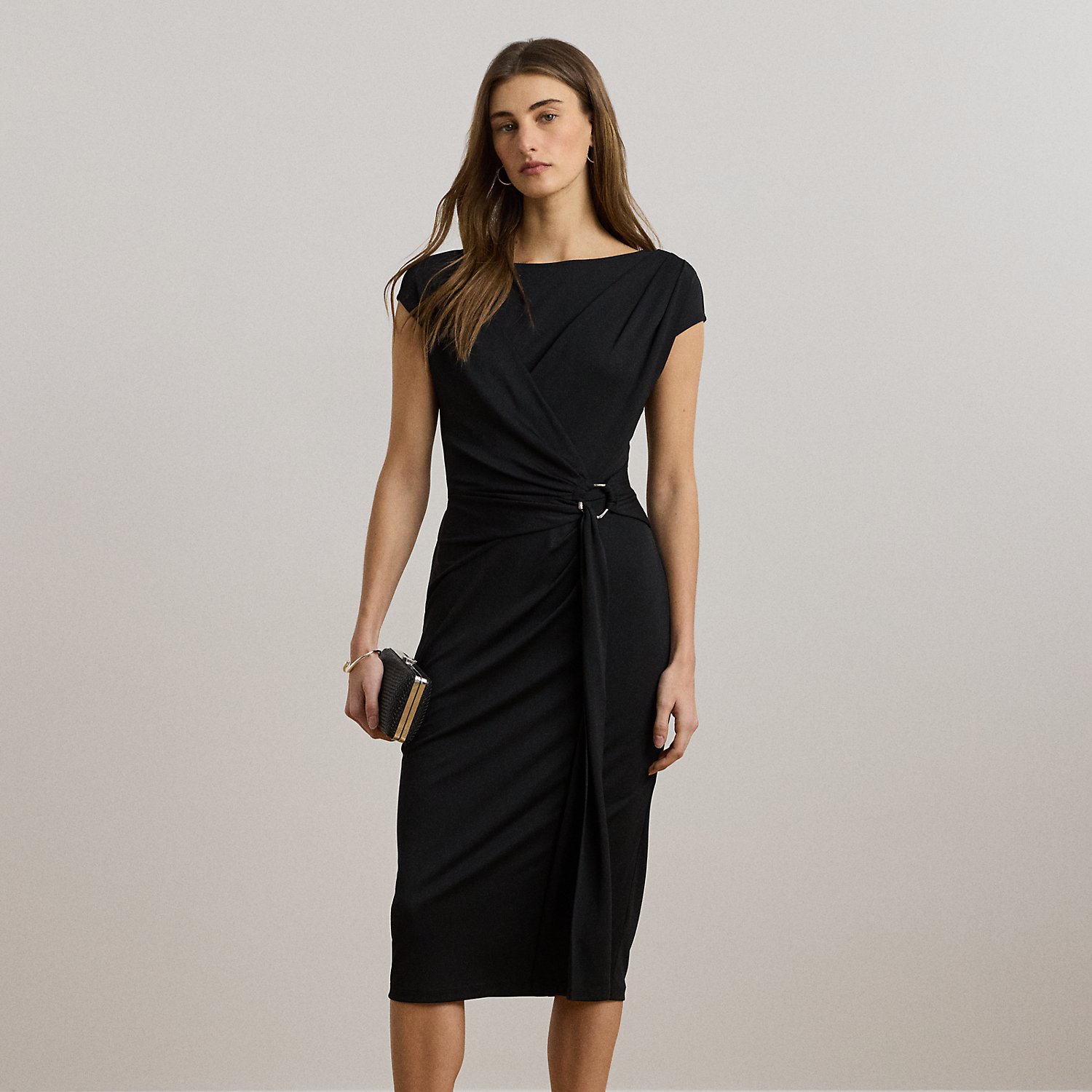 Rendered in smooth stretch jersey for ease of movement, this elegant cap-sleeve dress showcases a figure-skimming sheath silhouette and a pleated wrap-style overlay that gathers into a bamboo-inspired, textured metal O-ring at the waist.