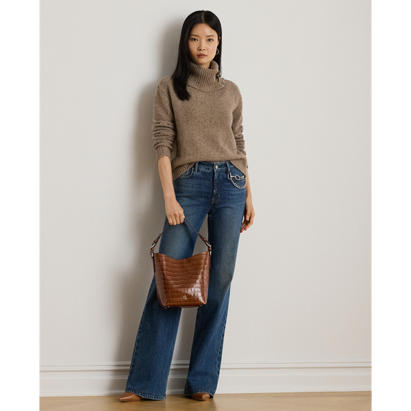 Cut for a leg-lengthening flared silhouette, these high-rise jeans are made with comfortable left-hand twill that offers just enough stretch for a relaxed fit and feel. This version pays homage to Ralph Lauren Lauren's equestrian-inspired spirit with a detachable horse bit chain embellishment at the left waist.