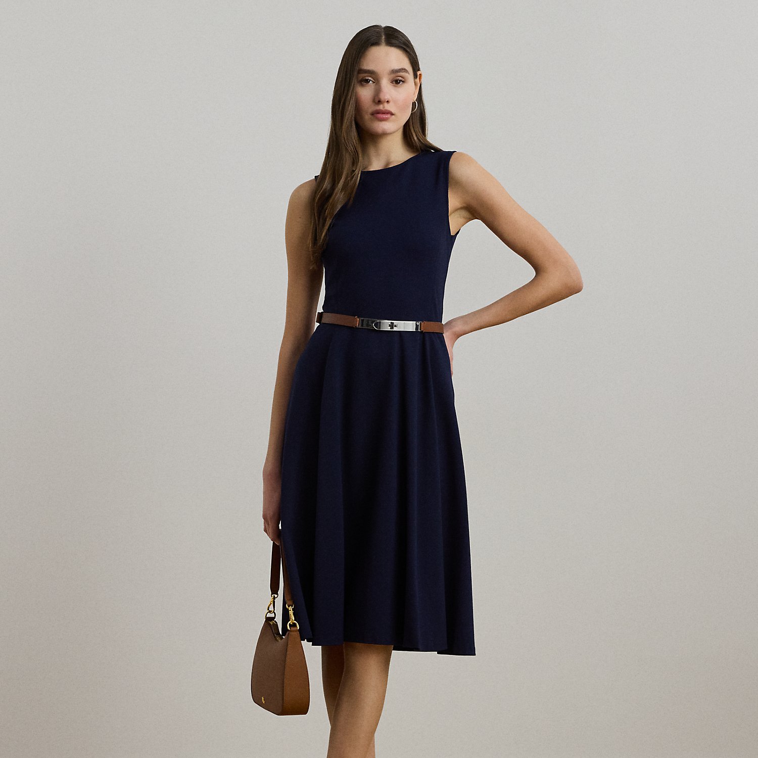 Straddle-stitched princess seams accentuate the fit-and-flare silhouette of this sleeveless dress, which is crafted with smooth, stretch-infused ponte.