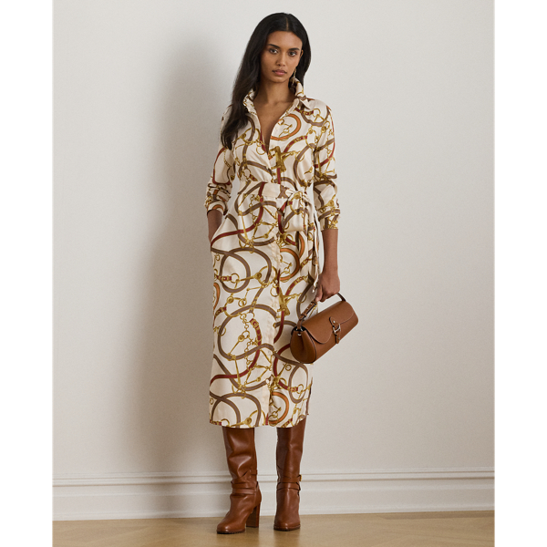 Crafted with smooth twill, this iteration of the classic shirtdress features a belted waist and an equestrian-inspired print that is quintessentially  Ralph Lauren Lauren.