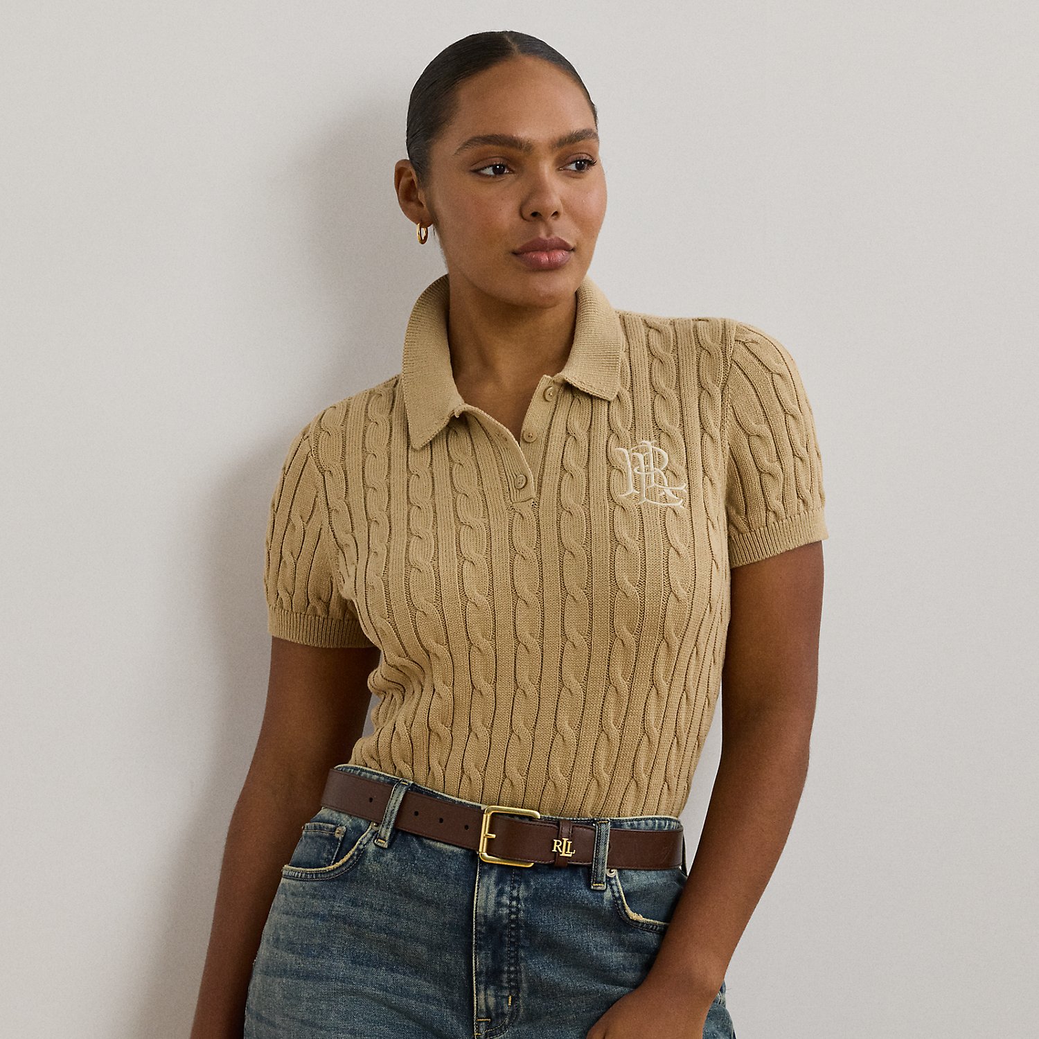Crafted from combed cotton for a soft hand, this piece unites a timeless Polo shirt silhouette with the comfort of a cable-knit jumper. It's detailed with Lauren's signature embroidered logo and "LRL"-engraved buttons.
