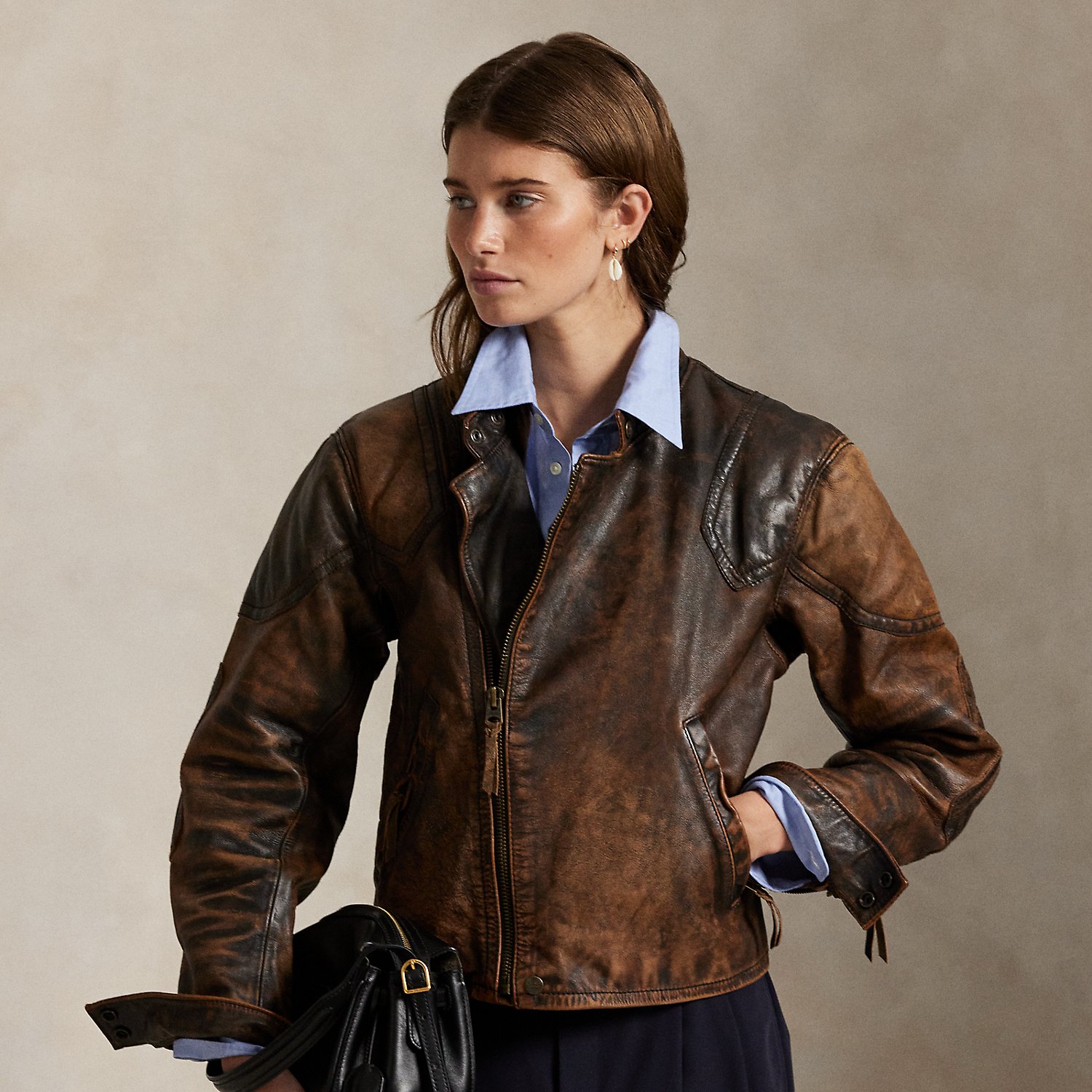 Designed for the look of a broken-in vintage find, this leather moto jacket is treated for a unique, crackled appearance with distinct nuances of shading that will continue to age and fade over time. The classic silhouette features articulated sleeves with padded shoulder and elbow patches, along with an allover diamond-quilted lining.