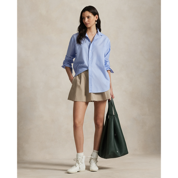 Crafted with cotton twill, this miniskirt merges the classic styling of Polo chinos with a playful A-line silhouette. It features pleated details at the front and is finished with a raw-edge hem.