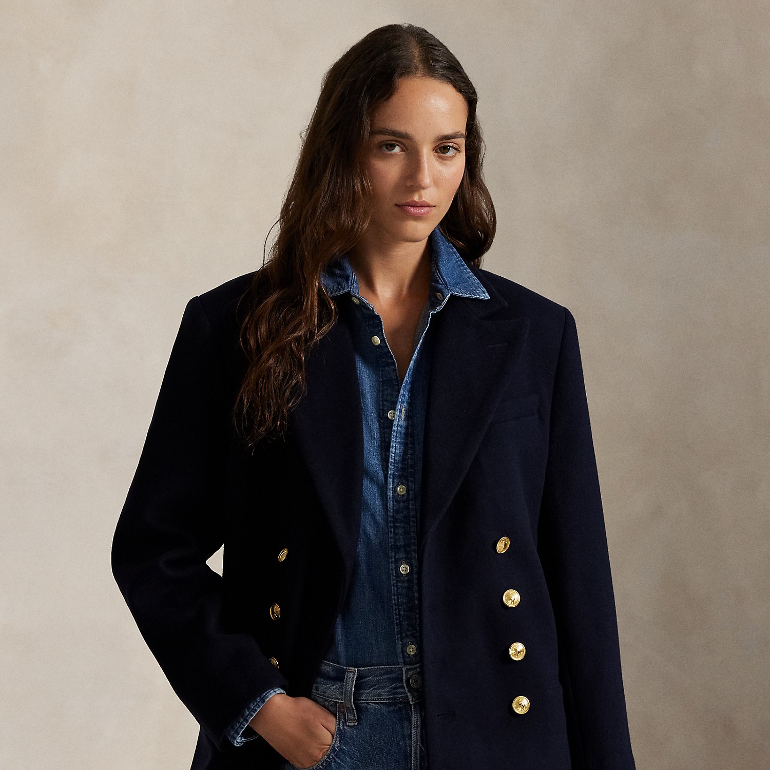 Finely crafted with Italian wool melton, this structured double-breasted jacket is designed with shoulder pads and a partial cupro lining. It's adorned with signature engraved buttons for a heritage-inspired finish.