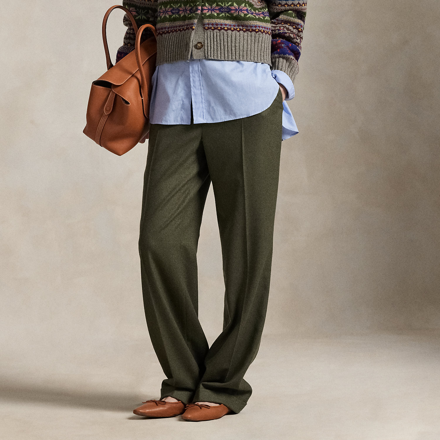 These wool twill trousers are cut for a relaxed, straight fit and have menswear-inspired details like an interior curtain waistband and crisp creases at the legs.