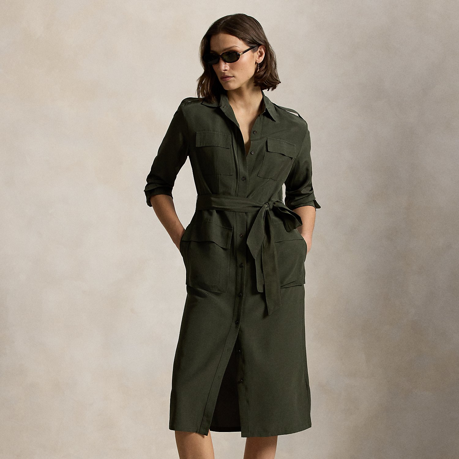 Smooth faille fabric brings an effortless drape to the structured lines of this belted shirtdress, which features utility-inspired details, including patch pocketing and buttoned shoulder epaulets.