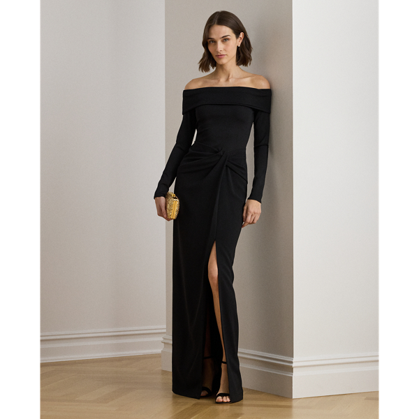 Timeless and elegant, this column gown combines a rib-knit off-the-shoulder bodice with a wrap-style crepe skirt.