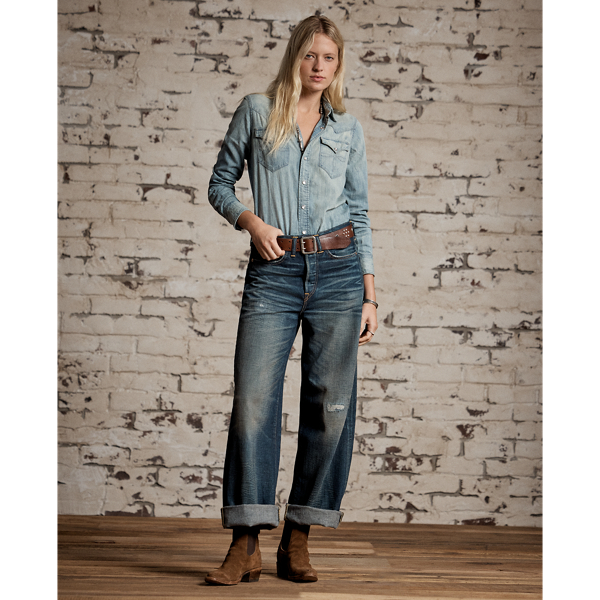 Relaxed-fitting, wide-leg jeans made with 12.75 oz. Japanese denim. 3x1 left-hand twill is dyed with true indigo. Dark high-contrast wash with an inky blue shade and hand-distressing creates an authentic vintage look. Adjustable buckled back and other detailing inspired by denim styles from the late 1930s.