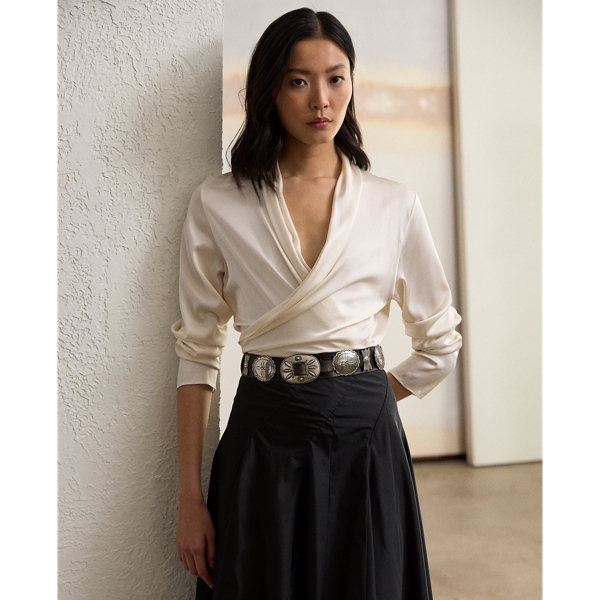 Crafted in Italy from stretch-infused silk charmeuse for a beautiful hand and a luxurious drape, the Shea blouse is designed with an array of romantic elements, including a convenient wrap closure, slightly relaxed long sleeves with genuine mother-of-pearl buttons and a shawl-style neckline.