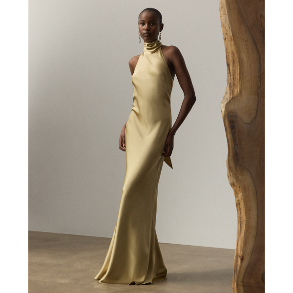 Originating in Spring 2023, the Chilton showcases Mr Lauren's ability to transform timeless silhouettes into modern designs. Crafted in Italy with stretch-infused satin, which is coveted for its beautiful sheen and fluid drape, this evening gown is distinguished by a halter silhouette with self-ties, which cascade beautifully down its dramatic open back.