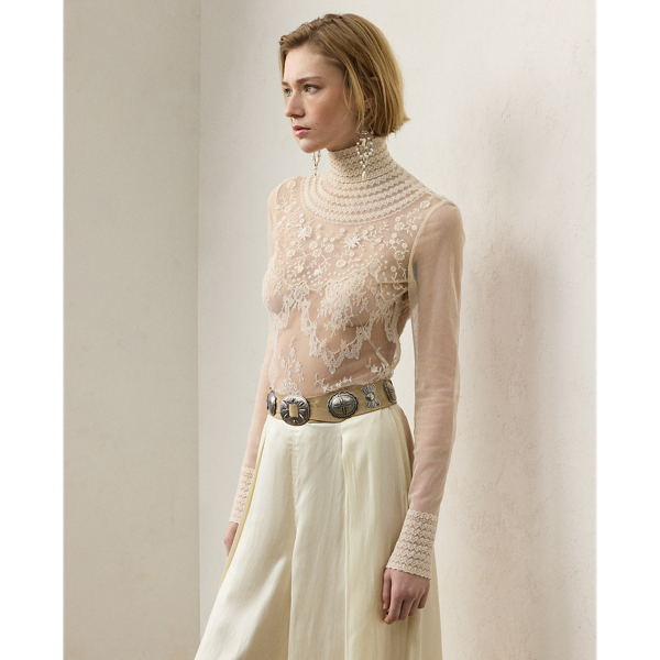 A study in fine Italian crafting, the Delilah's intricate design is formed with delicate French lace and hand-applied details, including floral embroidery and scalloping. Equipped with a camisole lining for opacity, this long-sleeve blouse features genuine mother-of-pearl buttons at the back and sleeve cuffs for ease of entry.