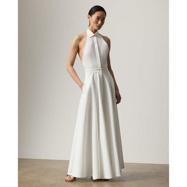 The Eldred day dress pairs a cotton broadcloth spread collar with Italian cotton piqué, which is considered for its durability and unique, subtle texture. A sleeveless halter silhouette enhances its warm-weather sensibility, while side on-seam pockets offer a casual feel.