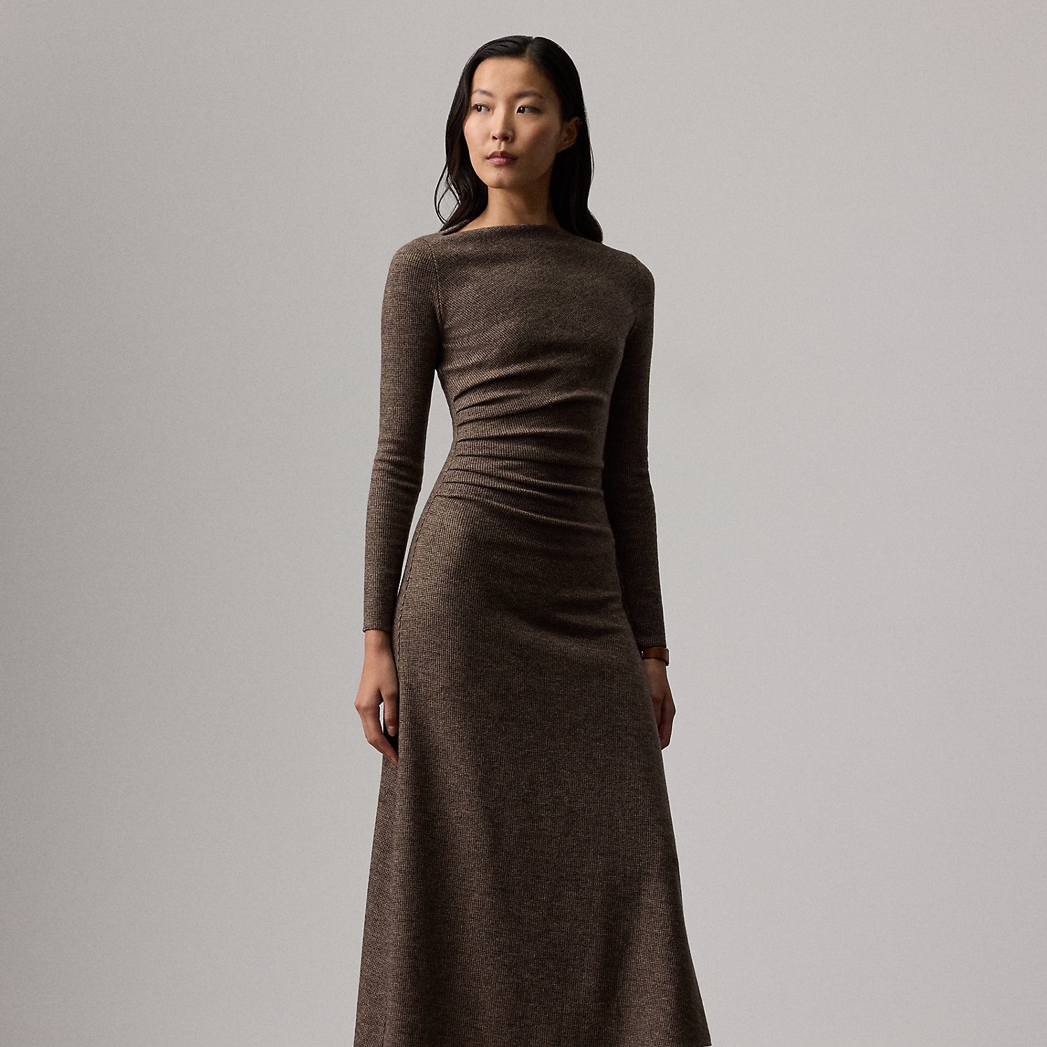 Uniting traditional tailoring elements with the appeal of soft dressing, the Nora features a flattering straight neckline, gathering at the waist and a sweeping A-line skirt. Crafted in Italy, this timeless style is made with tick-weave wool jersey for a remarkable drape and soft hand feel.