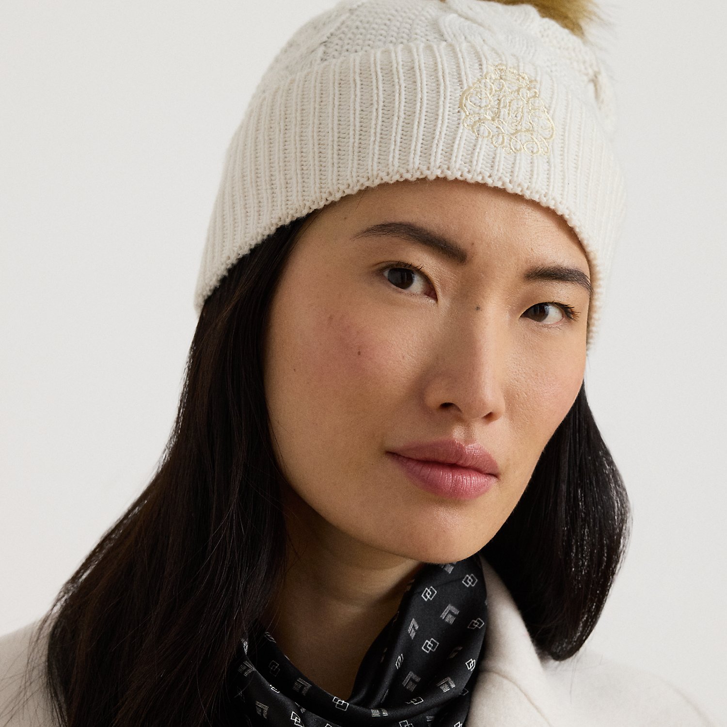 Embroidered-Crest Pom-Pom Cable Beanie
