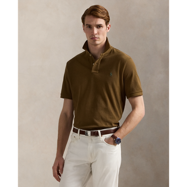 An American style standard since 1972, the Polo shirt has been imitated but never matched. Over the decades, Ralph Lauren Lauren has re-imagined his signature style in a wide array of colours and fits, yet all retain the quality and attention to detail of the iconic original. This Classic Fit version is made from our highly breathable cotton mesh, which offers a textured look and a soft feel.