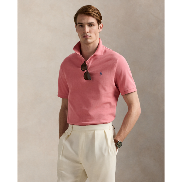 An American style standard since 1972, the Polo shirt has been imitated but never matched. Over the decades,  Ralph Lauren Lauren has re-imagined his signature style in a wide array of colours and fits, yet all retain the quality and attention to detail of the iconic original. This Classic Fit version is made from our highly breathable cotton mesh, which offers a textured look and a soft feel.