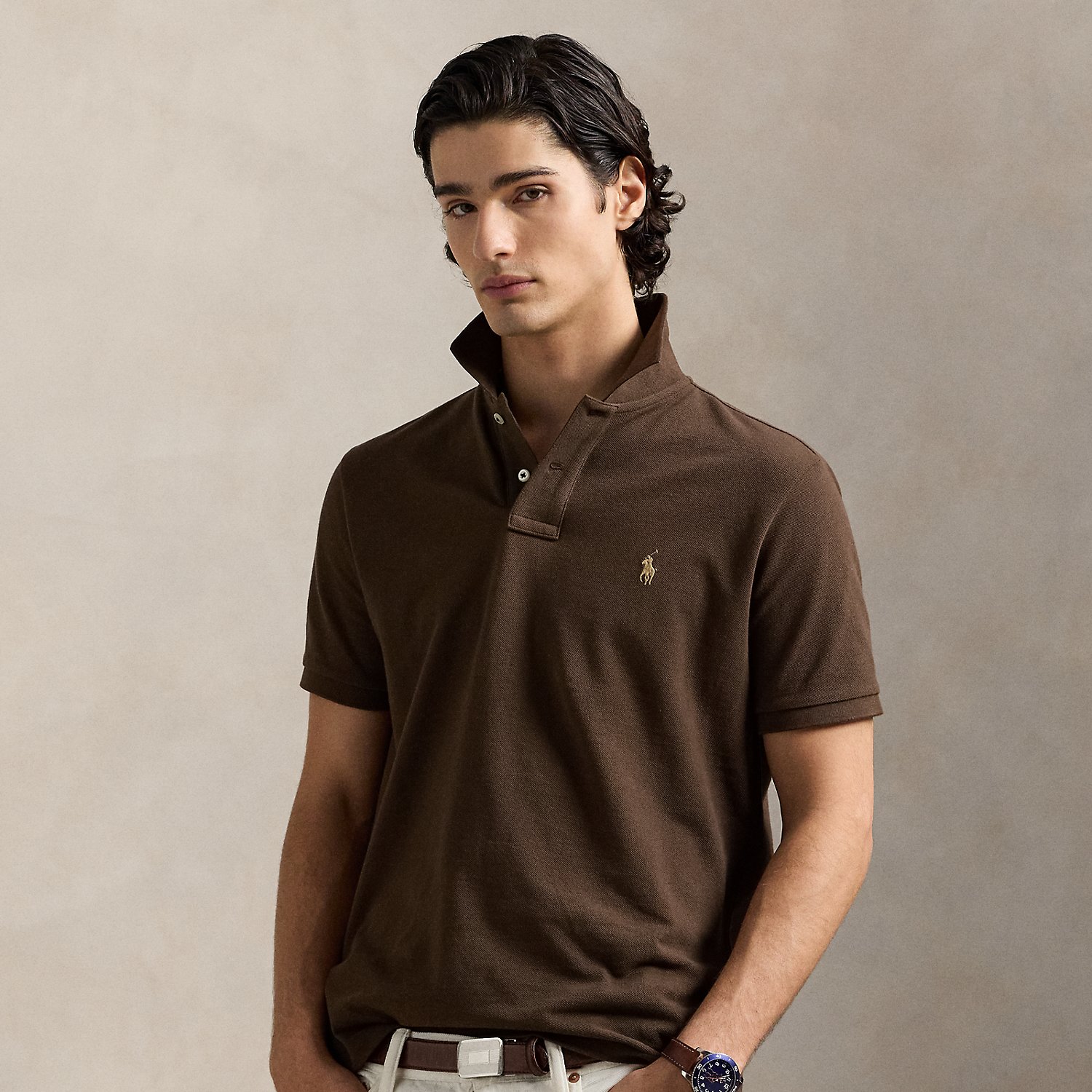An American style standard since 1972, the Polo shirt has been imitated but never matched. Over the decades, Ralph Lauren Lauren has re-imagined his signature style in a wide array of colours and fits, yet all retain the quality and attention to detail of the iconic original. This trim version is made from our highly breathable cotton mesh, which offers a textured look and a soft feel.