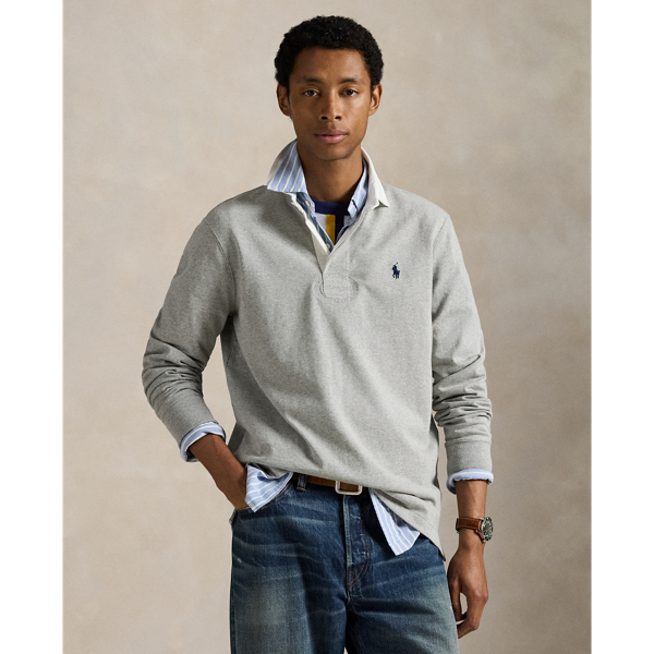 With its athletic details and timeless design, The Iconic Rugby Shirt captures the preppy yet sporty sensibility that has long defined the Polo  Ralph Lauren Lauren brand. This version features all the hallmarks of a traditional rugby shirt – the white point collar, concealed placket, rubber buttons and rib-knit cuffs. Made from durable cotton jersey that stays true to the sport's rough-and-tumble heritage, this shirt will stand up to repeated wear on and off the field of play.