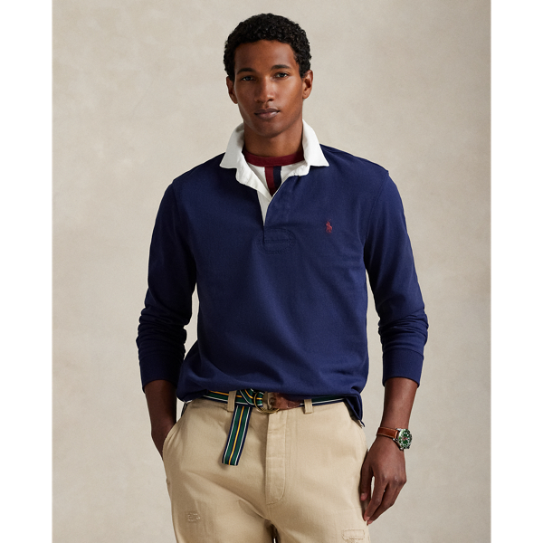 With its athletic details and timeless design, The Iconic Rugby Shirt captures the preppy yet sporty sensibility that has long defined the Polo  Ralph Lauren Lauren brand. This version features all the hallmarks of a traditional rugby shirt – the white point collar, concealed placket, rubber buttons and rib-knit cuffs. Made from durable cotton jersey that stays true to the sport's rough-and-tumble heritage, this shirt will stand up to repeated wear on and off the field of play.