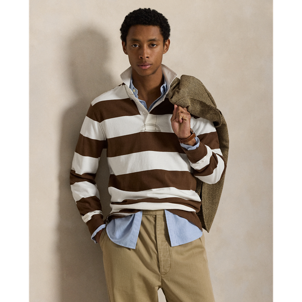With its athletic details and timeless design, the Iconic Rugby Shirt captures the preppy yet sporty sensibility that has long defined the Polo  Ralph Lauren Lauren brand. This version features all the hallmarks of a traditional rugby shirt – the distinctive stripe, white point collar, concealed placket, rubber buttons and rib-knit cuffs. Made from durable cotton jersey, which stays true to the sport's rough-and-tumble heritage, this shirt will stand up to repeated wear on and off the pitch.