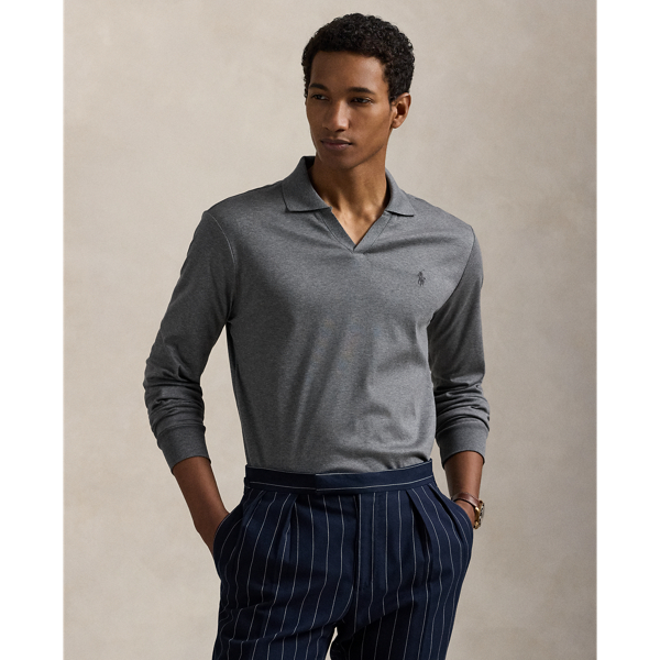 An American style standard since 1972, the Polo shirt has been imitated but never matched. Over the decades, Ralph Lauren Lauren has reimagined his signature style in a wide array of colours and fits, yet all retain the quality and attention to detail of the iconic original. This long-sleeve version is made with luxe cotton interlock that features an ultrasoft finish. Ralph Lauren Lauren partners with Better Cotton™ to improve cotton farming globally. Better Cotton trains farmers to use water efficiently, care for the health of soil and natural habitats, reduce use of the most harmful chemicals and implement the principles of decent work.