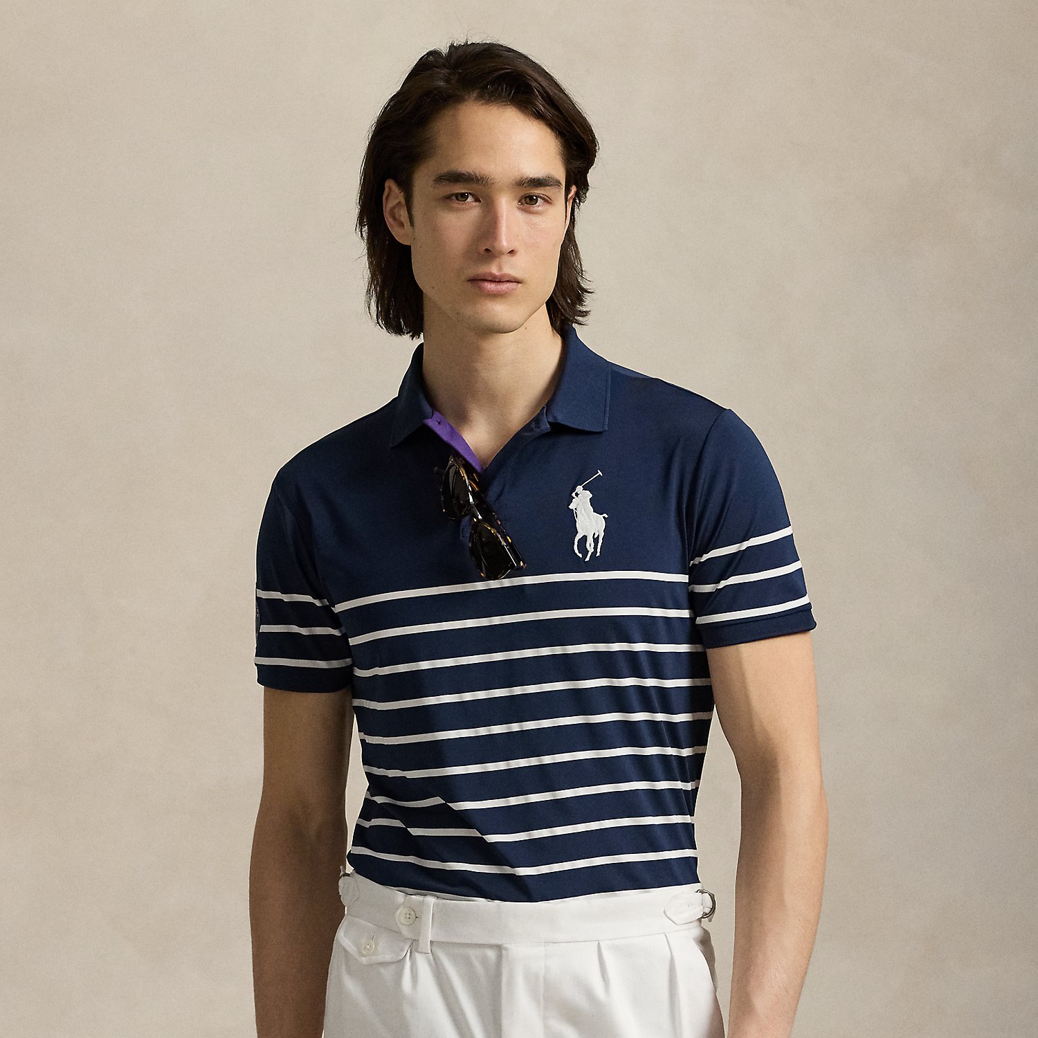 Part of our collection celebrating Wimbledon 2025, this striped Polo shirt was designed exclusively for the tournament's ballperson uniform. Its stretch jersey fabric features moisture-wicking properties to help keep you cool and comfortable.