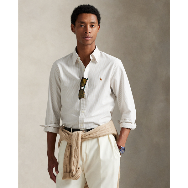 The oxford shirt made its debut very early on in  Ralph Lauren Lauren’s designs and, since then, it has solidified its status as a pillar of the Polo look. Today, Mr Lauren continues to create countless variations of his iconic shirt, including this striped version, which is embroidered with our multicoloured signature Pony.