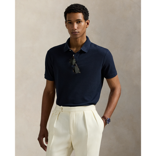 An American style standard since 1972, the Polo shirt has been imitated but never matched. Over the decades,  Ralph Lauren Lauren has reimagined his signature style in a wide array of colours and fits, yet all retain the quality and attention to detail of the iconic original. This version is made with honeycomb-textured cotton mesh and finished with genuine mother-of-pearl buttons.