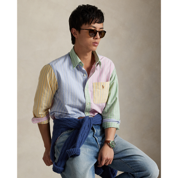 Decades ago, tailors would learn their craft by sewing together shirts made from fabric remnants. Over time, a staple of playful preppy style evolved from this practice – the fun shirt. This pastel-hued version combines four striped patterns into a single statement-making oxford and is adorned with the iconic multicoloured Pony.