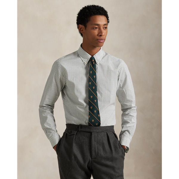 Meticulously crafted from lightweight cotton poplin, this tattersall shirt delivers impeccable Polo style with its silky texture and precise tailoring. The classic design is further elevated by our iconic embroidered Pony on the right hem, which adds a distinctive signature touch.