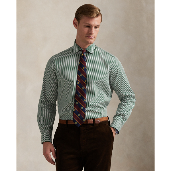 Meticulously crafted with lightweight cotton poplin, this striped shirt delivers impeccable Polo style with its crisp texture and precise tailoring. The classic design is further elevated by our iconic embroidered Pony, which adds a distinctive signature touch.