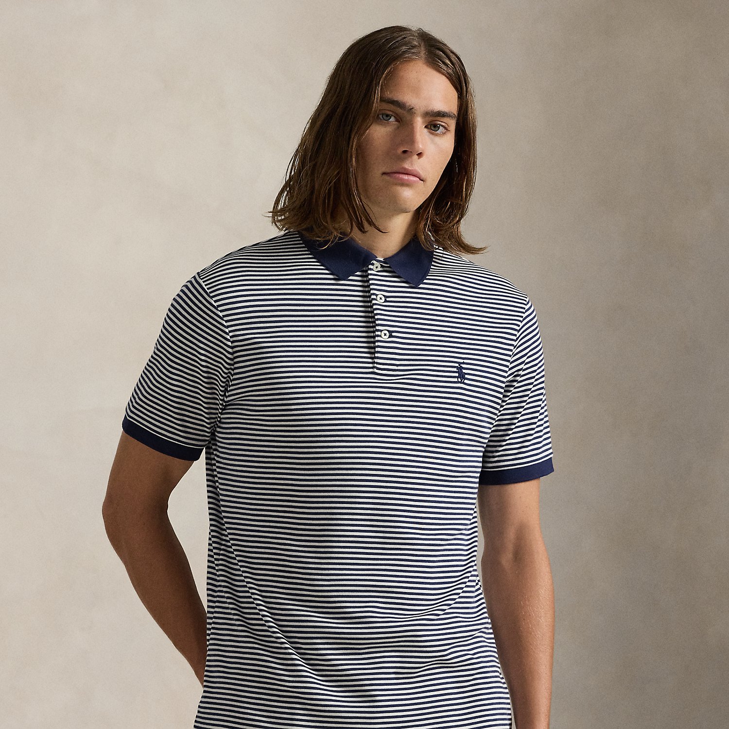 An American style standard since 1972, the Polo shirt has been imitated but never matched. Over the decades, Ralph Lauren Lauren has re-imagined his signature style in a wide array of colours and fits, yet all retain the quality and attention to detail of the iconic original. This striped version is made with luxe cotton interlock featuring an ultrasoft finish.