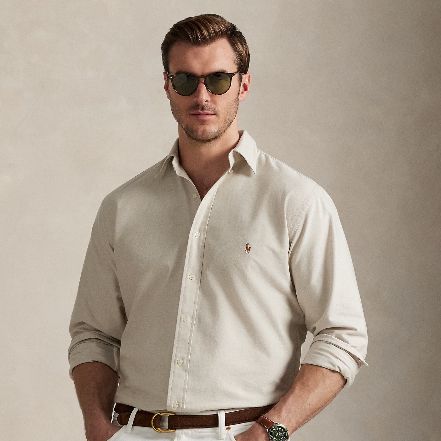 The oxford shirt made its debut very early in Ralph Lauren Lauren’s designs, and since then, it has solidified its status as a pillar of the Polo look. Our fabric is developed with a secret wash, which gives it instant character, ease and a heathered softness – what we refer to as "the perfect rumple". The formula is so unique that it's been kept in a safe for more than three decades. Today, Mr Lauren continues to create countless variations of his iconic shirt, including this Big & Tall version, which is embroidered with our multicoloured signature Pony.