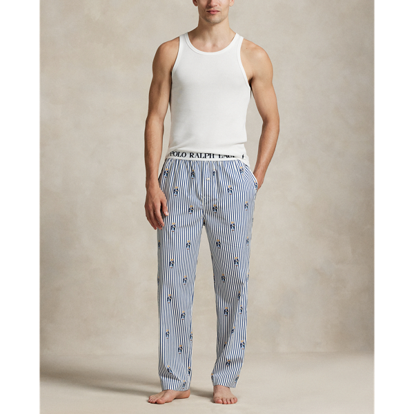 Crafted with crisp cotton poplin, these lightweight pyjama trousers feature an allover pattern of the iconic Polo Bear on a striped background.