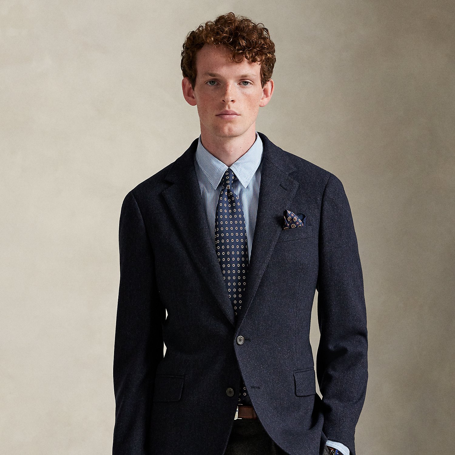 Our Polo sport coat offers more structure in the chest and shoulders along with full lining. This wool-blend version is crafted from a custom-developed herringbone fabric for a classic Ralph Lauren Lauren look.