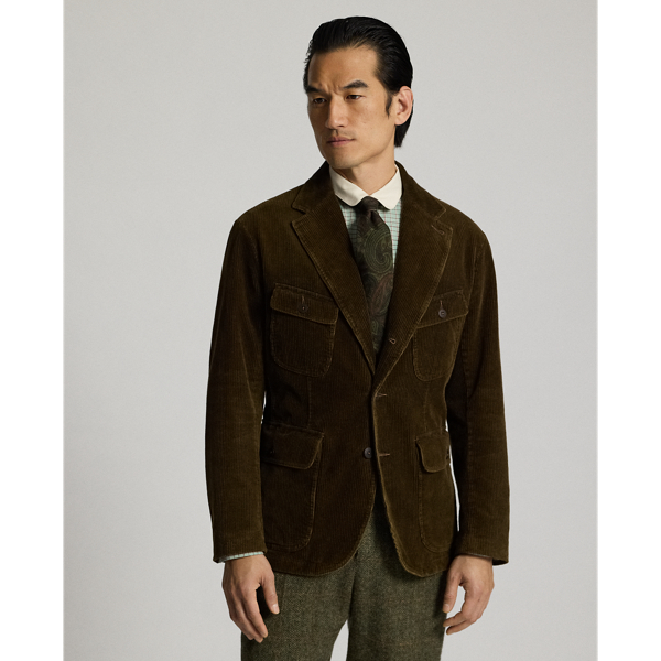 Notch-lapel blazer made from wide-wale cotton corduroy. Four pockets on the front. Half-lined. Heavily washed. Corozo buttons.