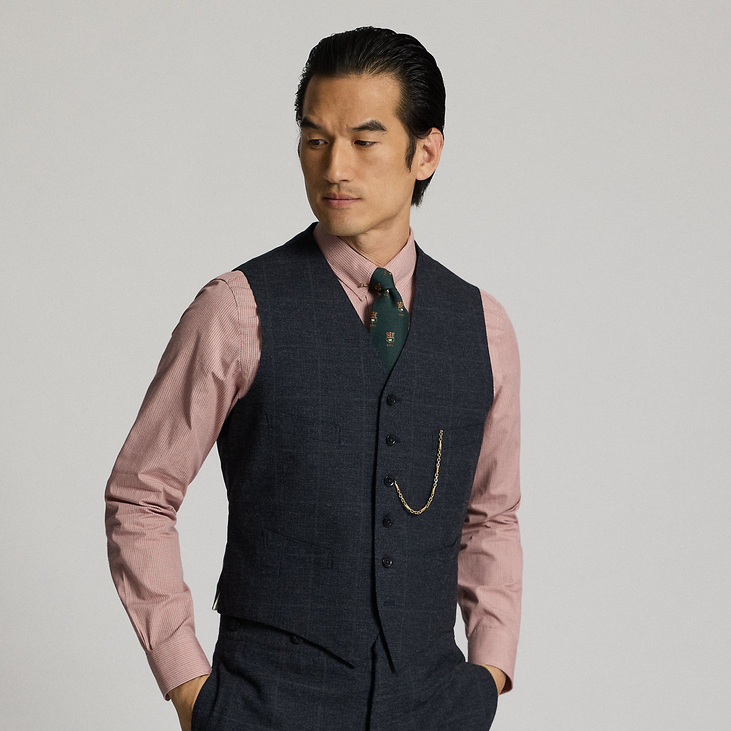 Classic waistcoat tailored in Italy from Japanese herringbone cloth dyed with true indigo. Subtle micro-check pattern is over-printed with a windowpane motif. Adjustable buckled back. Fully lined.